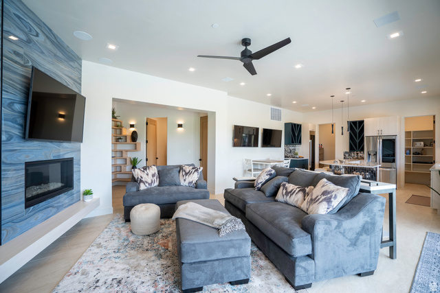 3606 South Cypress Road Hurricane, UT 84737 - Photo 57 of 69 Living area with a ceiling fan, a high end fireplace, recessed lighting, and built in shelves