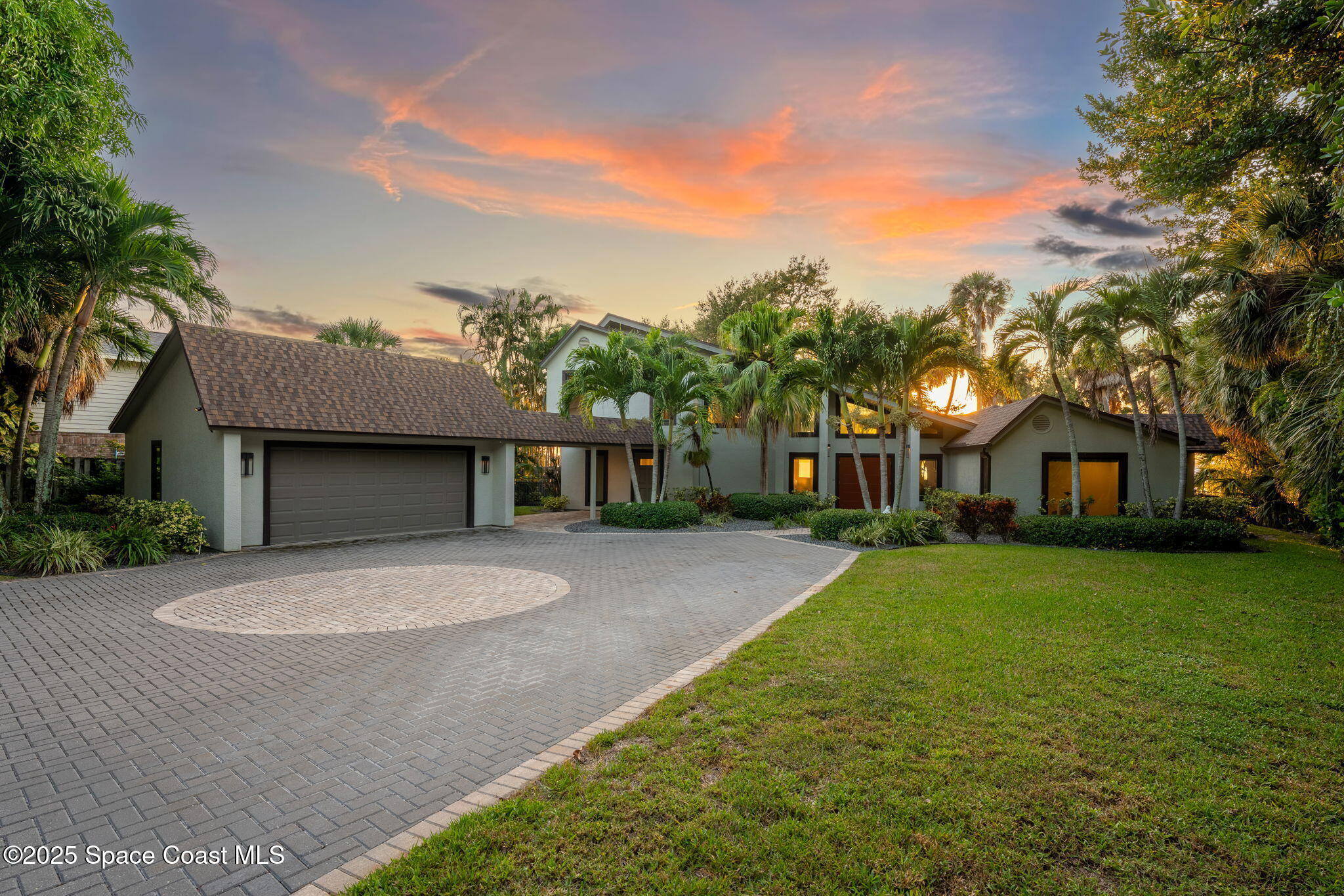 8535 South Tropical Trail Merritt Island, FL 32952 - Photo 1 of 44 a front view of a house with a yard and trees