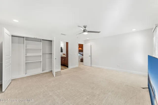 a view of an empty room with a cabinet