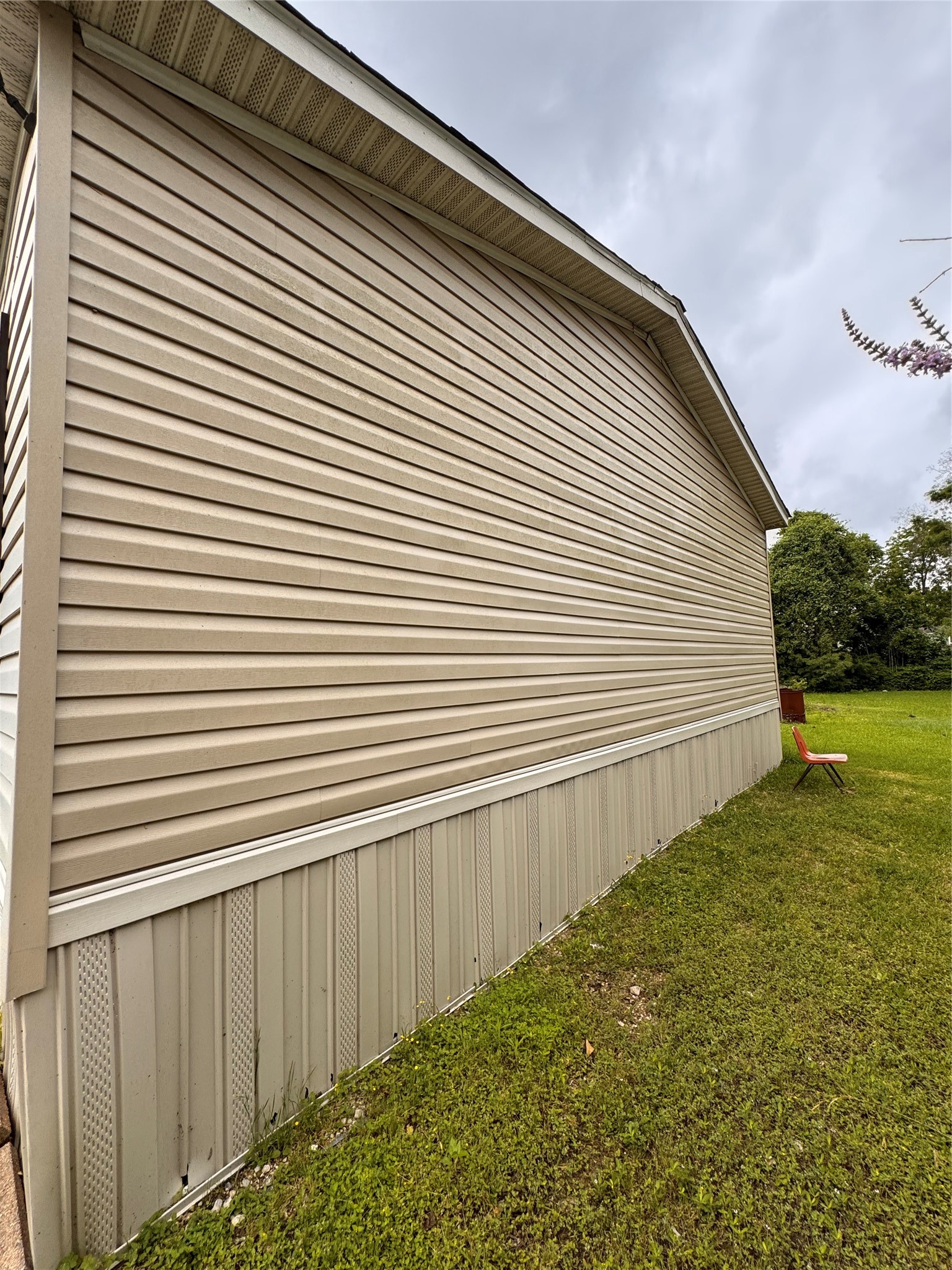 7903 Spivey Road Highlands, TX 77562 - Photo 5 of 6 a view of a backyard with a chair