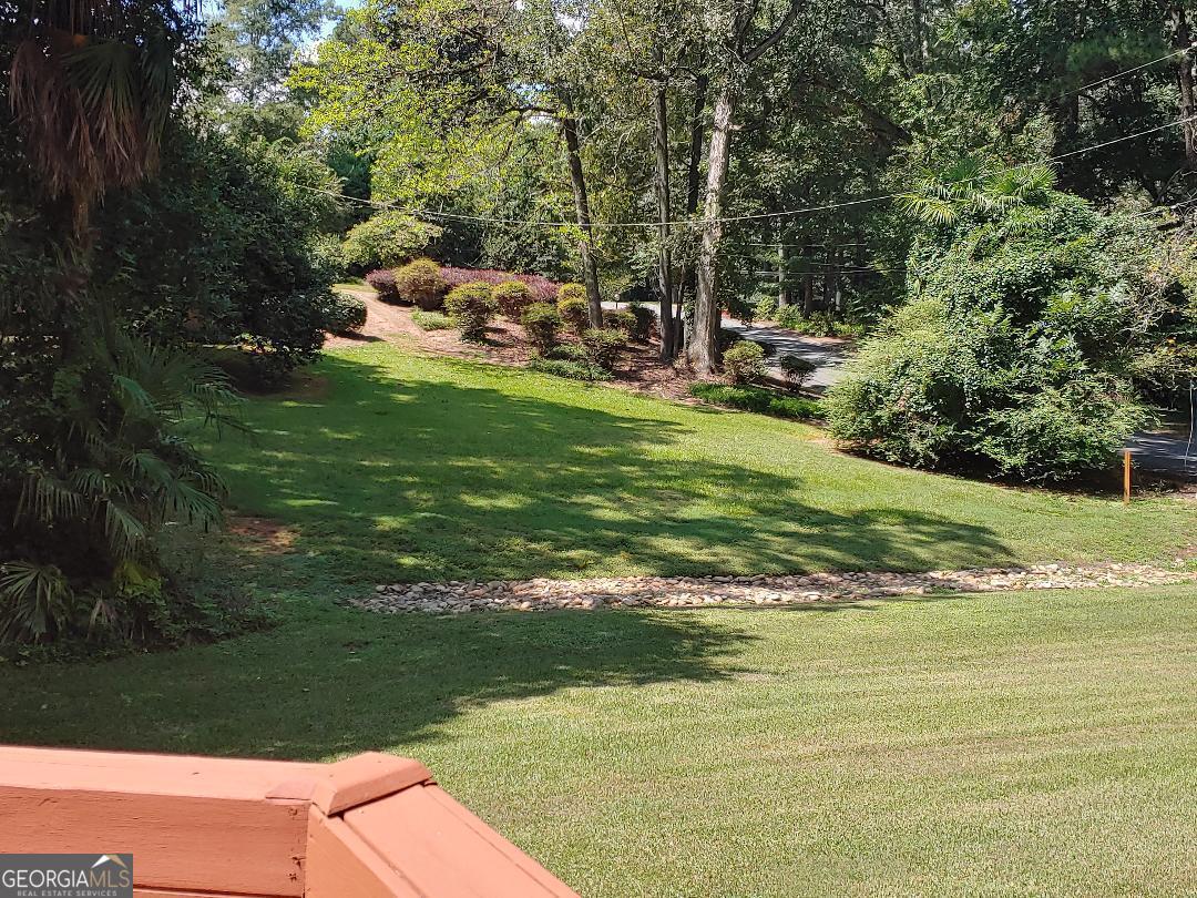 428 Wesleyan Drive Macon, GA 31210 - Photo 22 of 26 a view of a lake with a yard