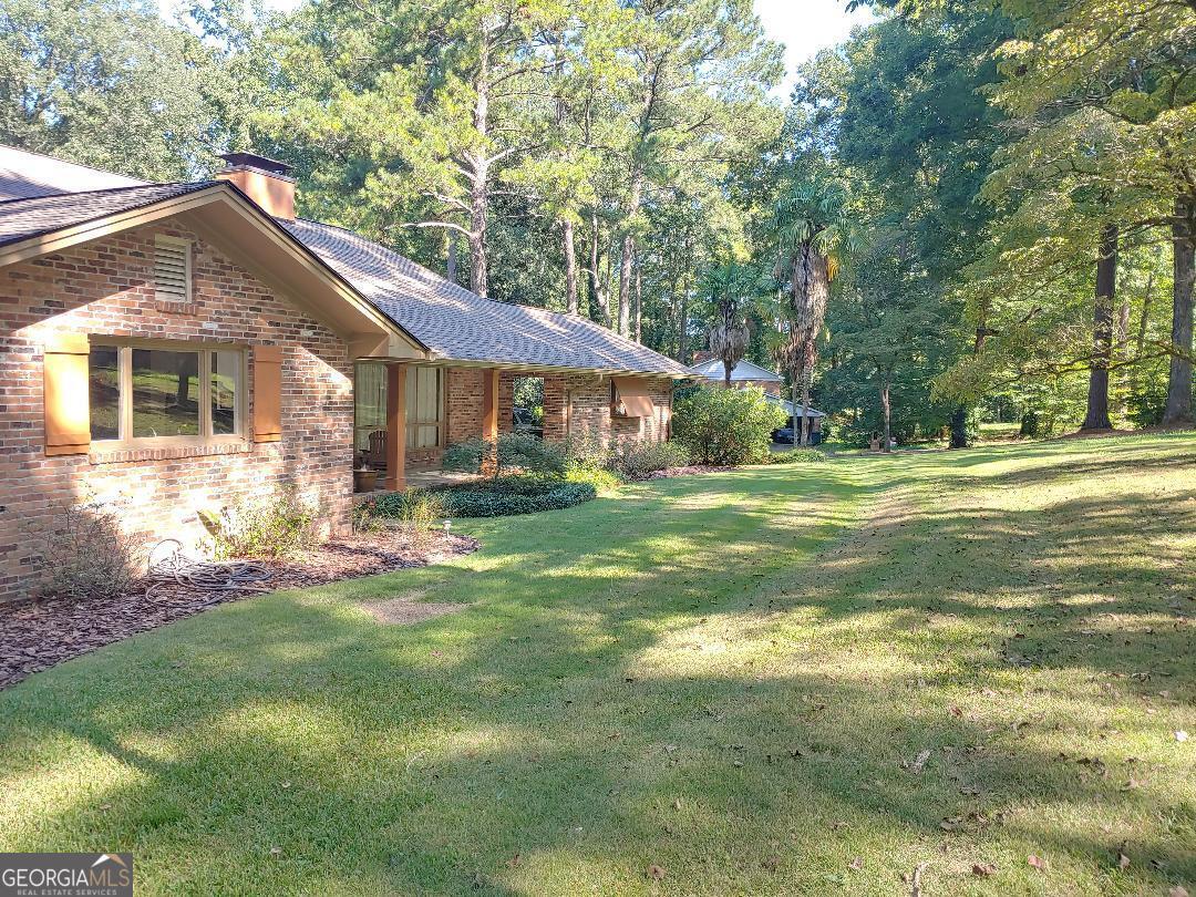 428 Wesleyan Drive Macon, GA 31210 - Photo 23 of 26 a front view of a house with a yard