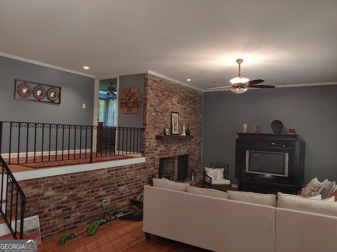 428 Wesleyan Drive Macon, GA 31210 - Photo 4 of 26 a living room with furniture and a fireplace