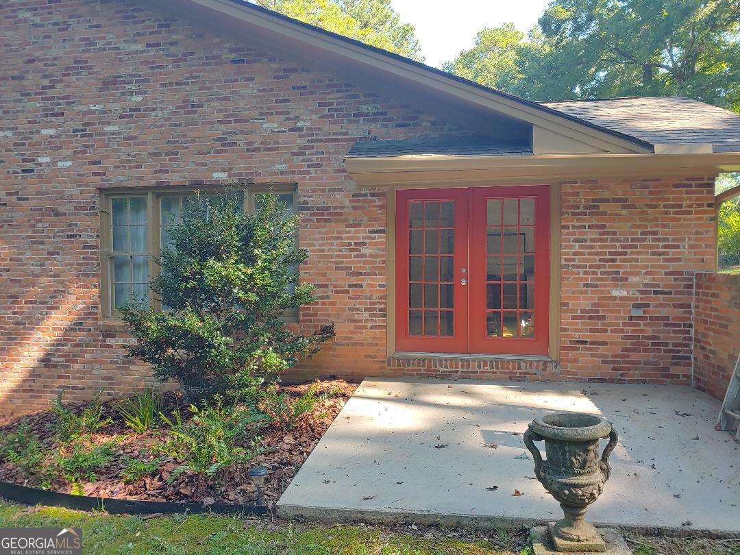 428 Wesleyan Drive Macon, GA 31210 - Photo 8 of 26 a view of a brick house with a yard