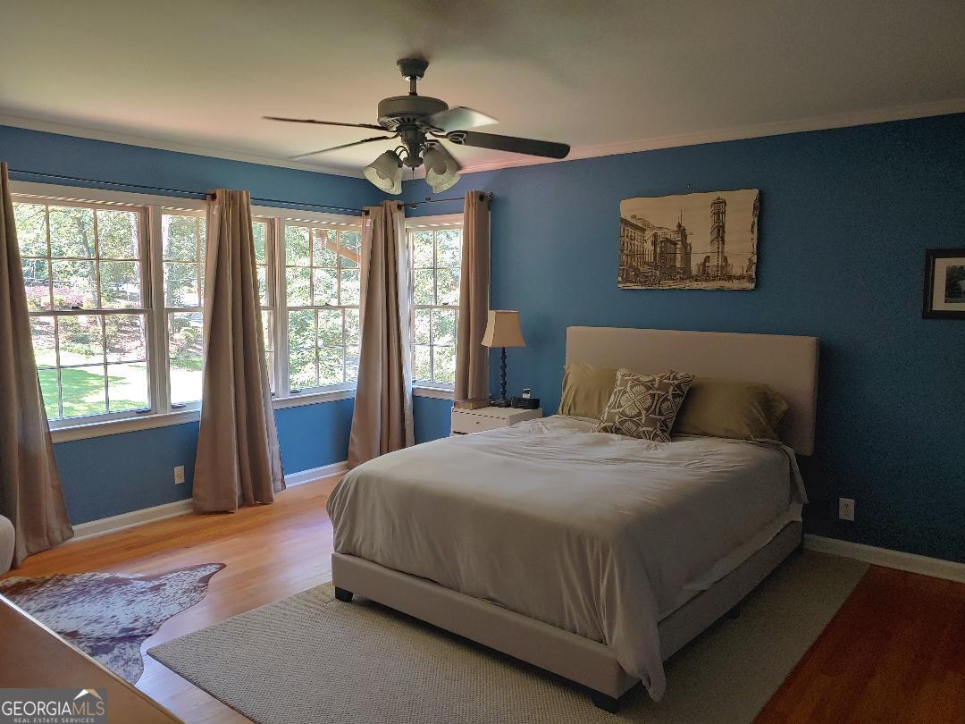 428 Wesleyan Drive Macon, GA 31210 - Photo 9 of 26 a bedroom with a large bed and a window