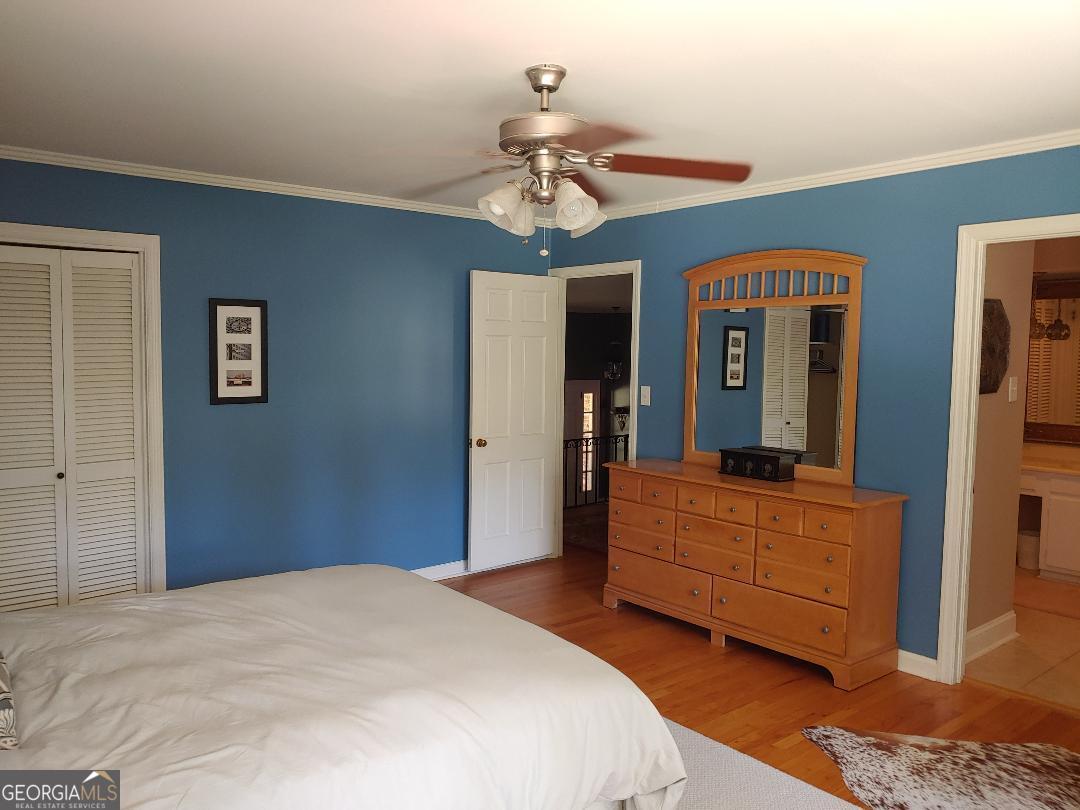 428 Wesleyan Drive Macon, GA 31210 - Photo 10 of 26 a bedroom with a bed and a chandelier