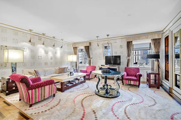 a view of a livingroom with furniture and a flat screen tv