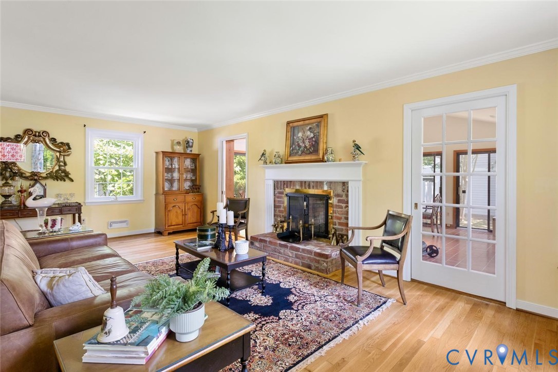 10260 Maplested Lane Henrico, VA 23229 - Photo 12 of 38 Living area featuring a brick fireplace with a whi