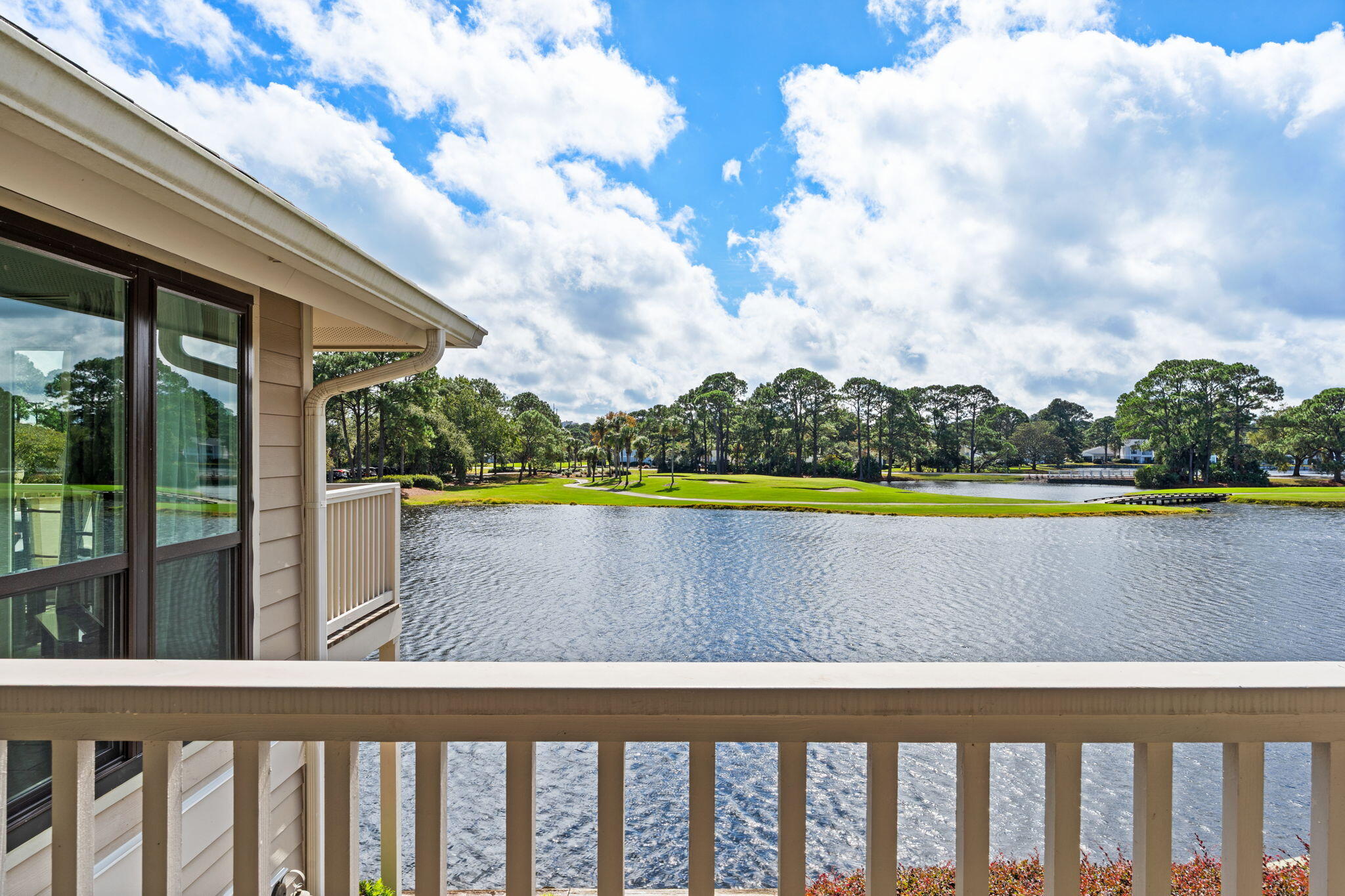 918 Harbour Point Lane, Unit 918 Miramar Beach, FL 32550 - Photo 13 of 43 a view of swimming pool with lawn chairs and wooden fence