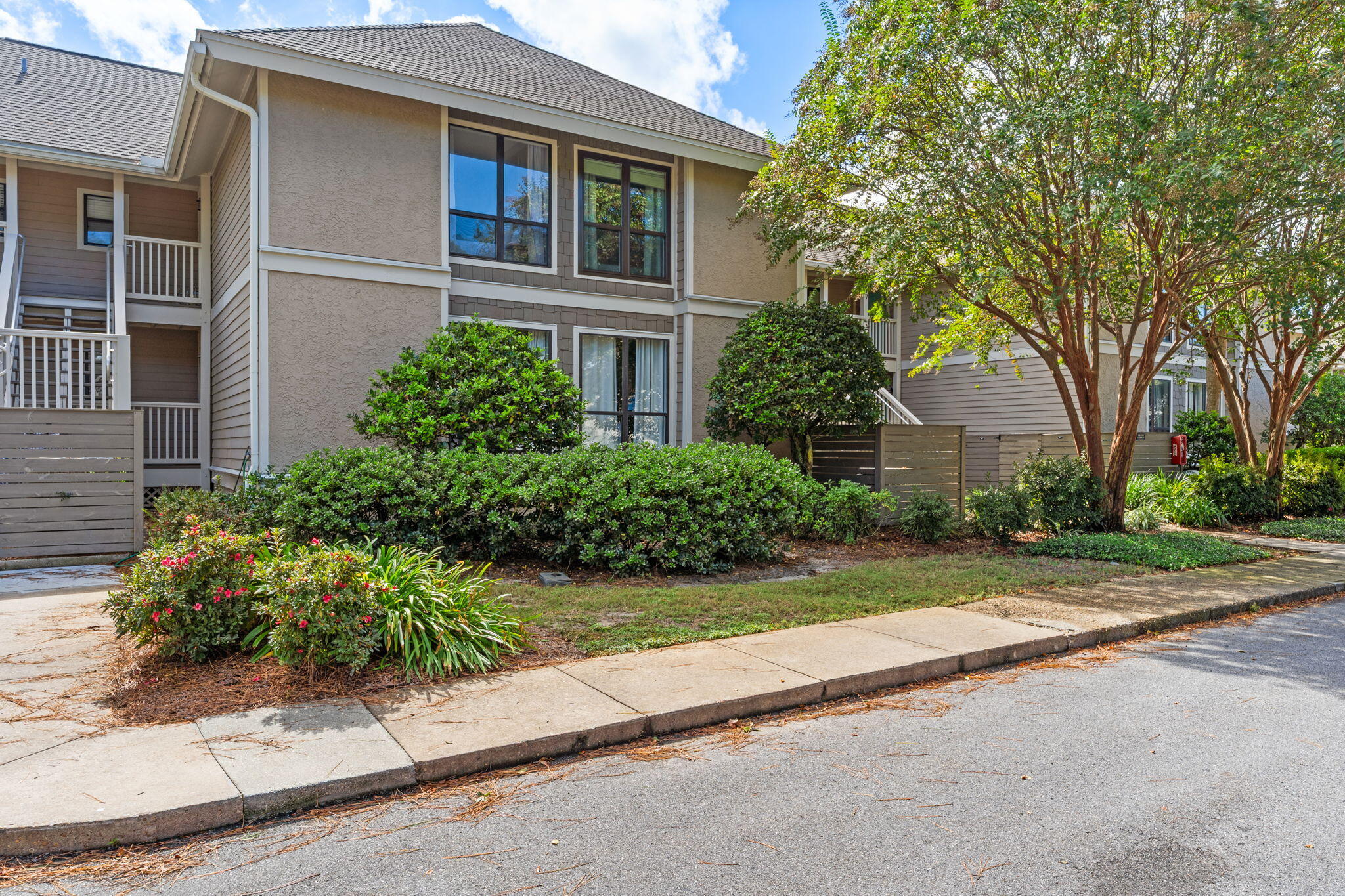 918 Harbour Point Lane, Unit 918 Miramar Beach, FL 32550 - Photo 32 of 43 front view of a house with a garden