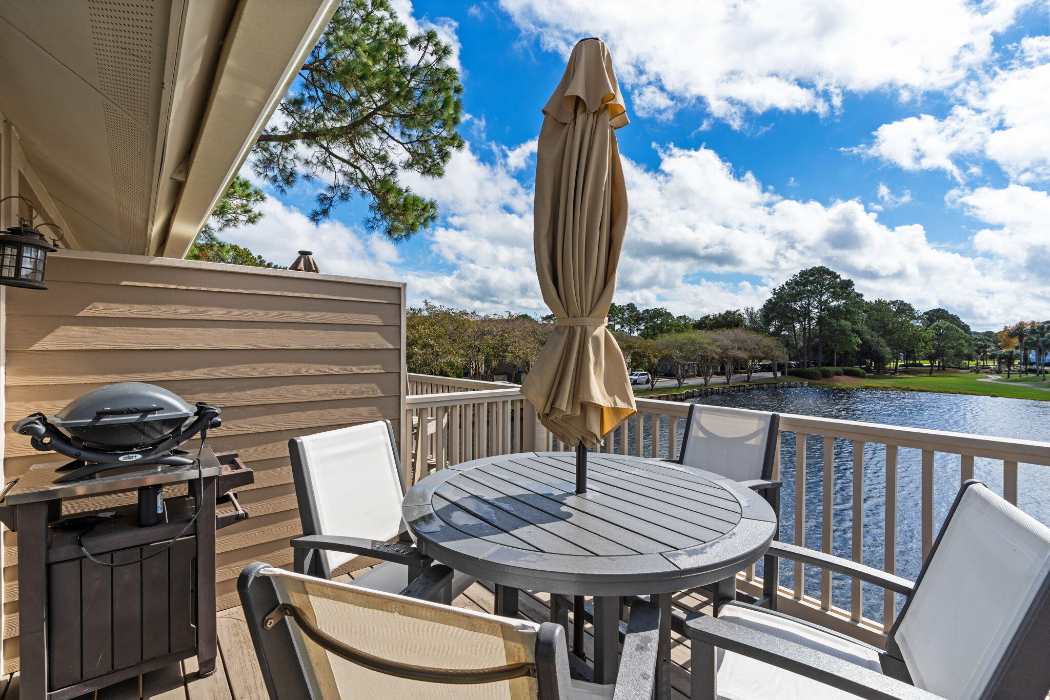 918 Harbour Point Lane, Unit 918 Miramar Beach, FL 32550 - Photo 5 of 43 a view of a balcony with two chairs and a table