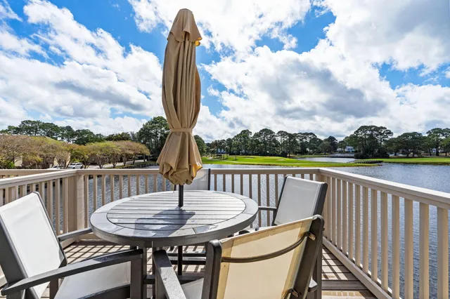 a view of a chair and table in the balcony