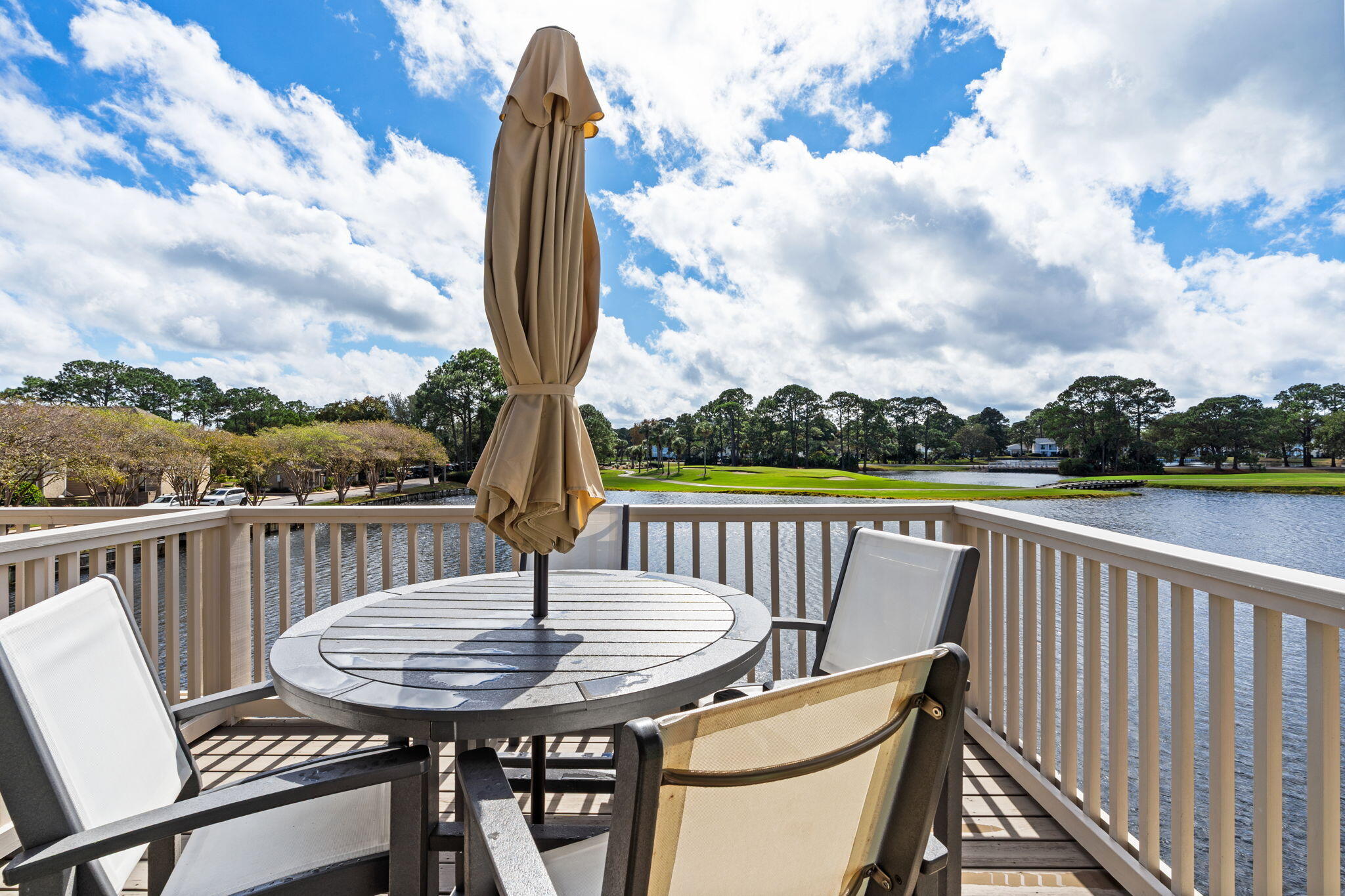 918 Harbour Point Lane, Unit 918 Miramar Beach, FL 32550 - Photo 6 of 43 a view of a chair and table in the balcony