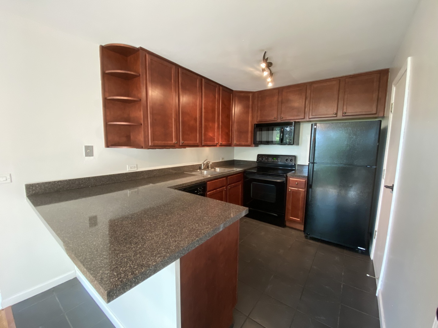 5904 Forest View Road, Unit 2F Lisle, IL 60532 - Photo 4 of 10 a kitchen with granite countertop a refrigerator a stove and a sink