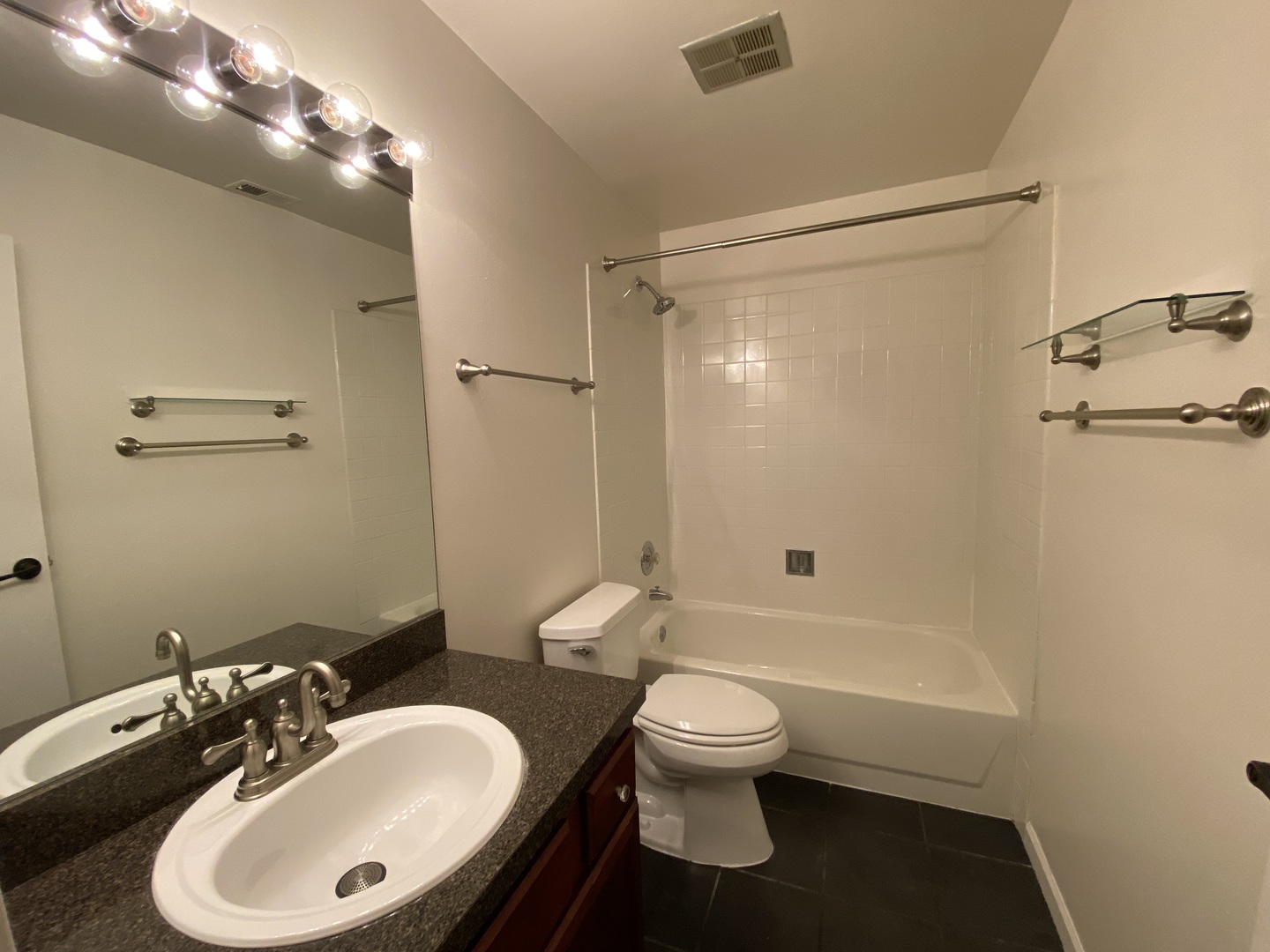 5904 Forest View Road, Unit 2F Lisle, IL 60532 - Photo 10 of 10 a bathroom with a sink toilet and shower