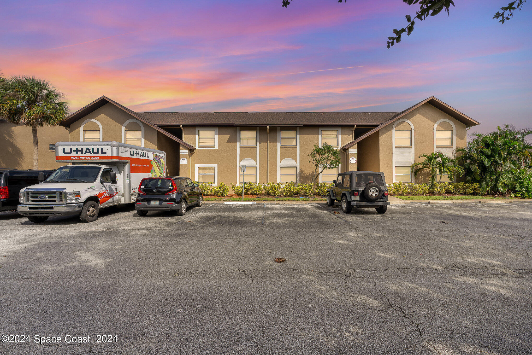 280 Spring Drive, Unit 8 Merritt Island, FL 32953 - Photo 1 of 26 a view of a car parked in front of a house