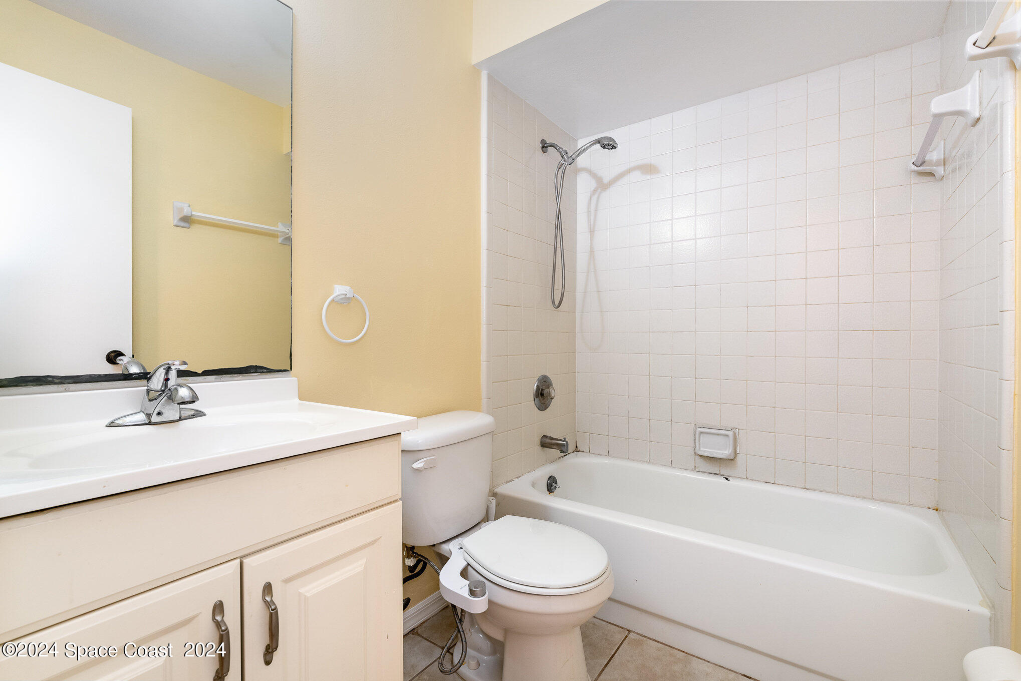 280 Spring Drive, Unit 8 Merritt Island, FL 32953 - Photo 24 of 26 a bathroom with a sink a toilet and a bathtub