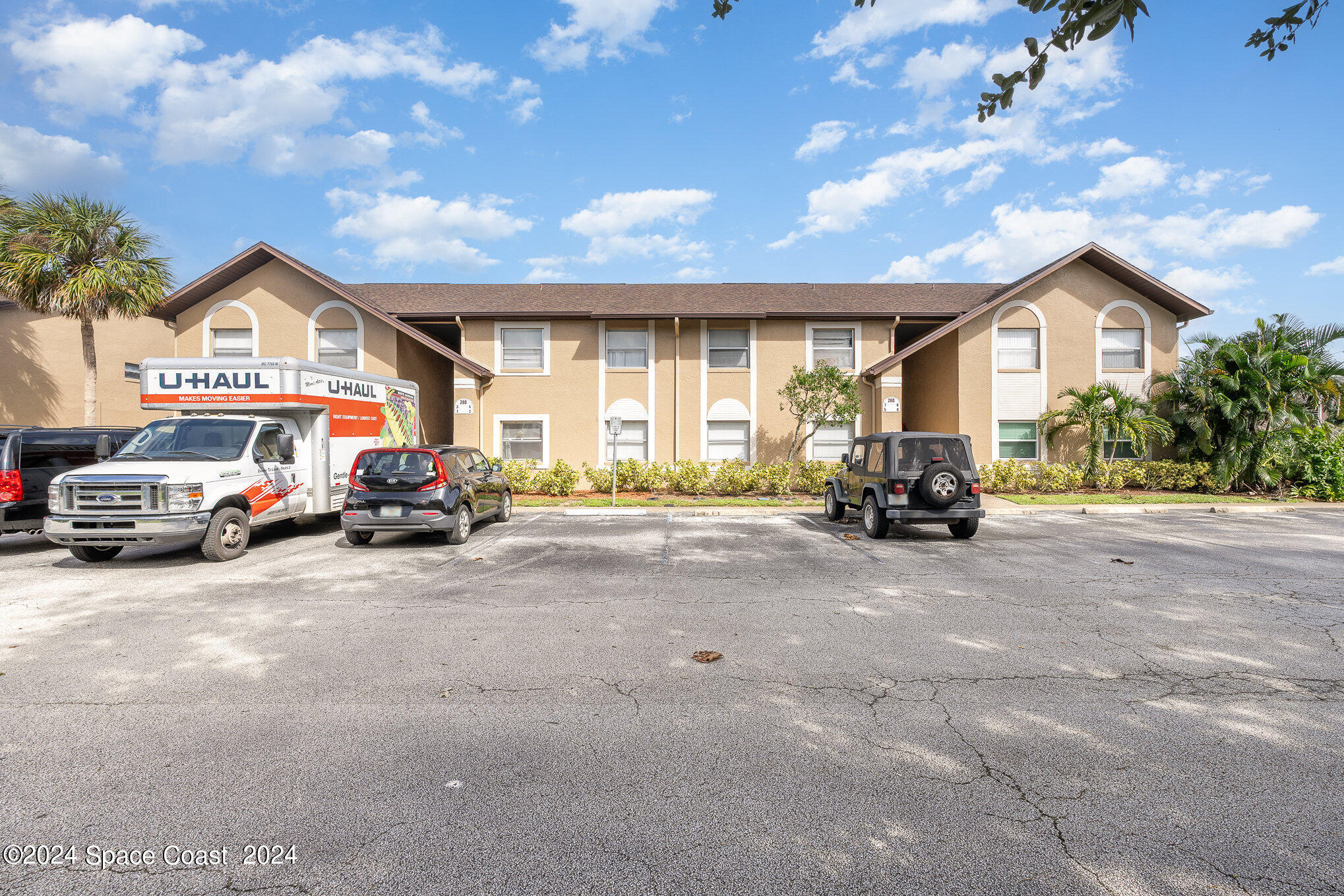 280 Spring Drive, Unit 8 Merritt Island, FL 32953 - Photo 3 of 26 a view of car parked in front of house