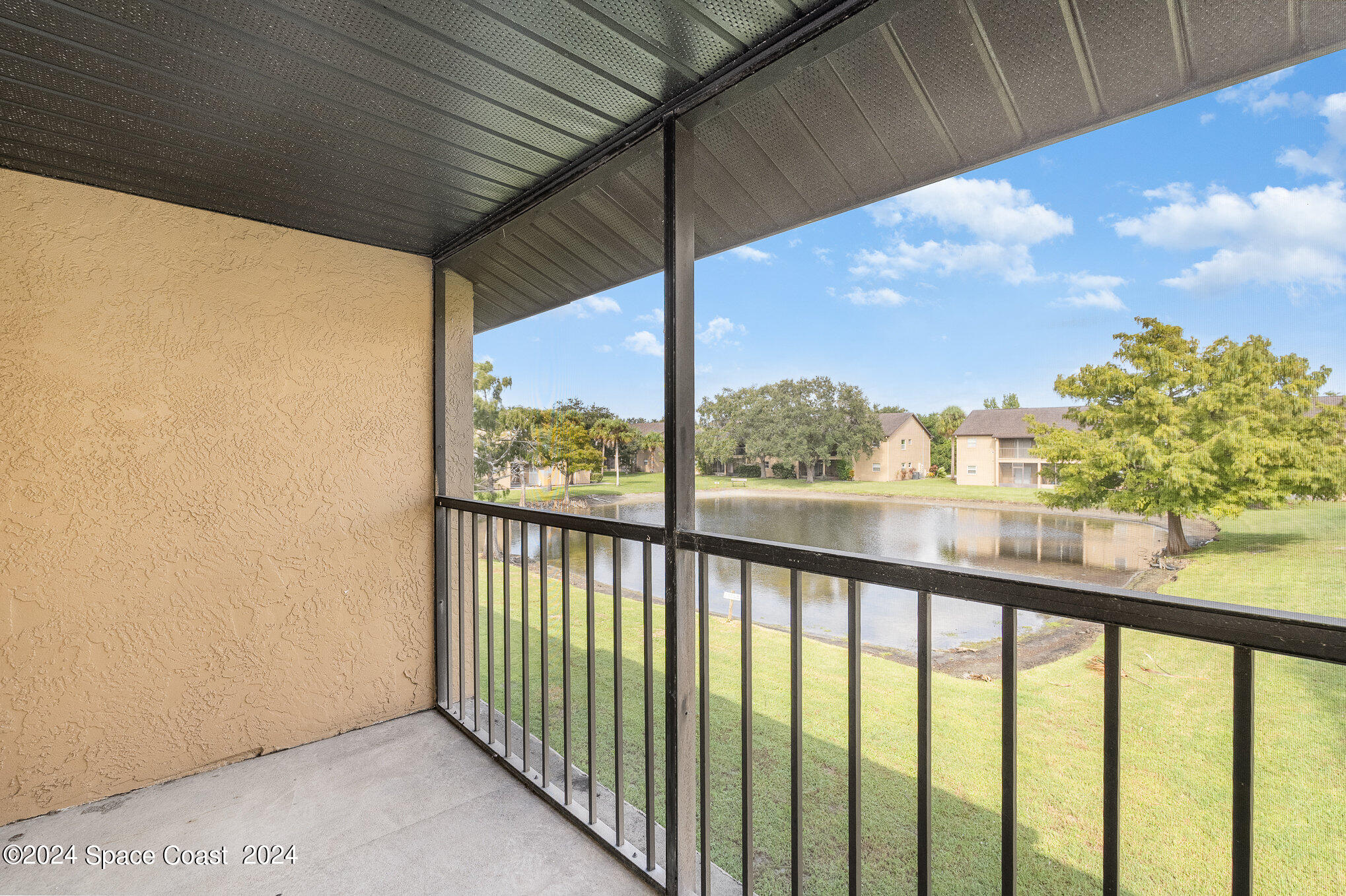 280 Spring Drive, Unit 8 Merritt Island, FL 32953 - Photo 8 of 26 a view of a porch