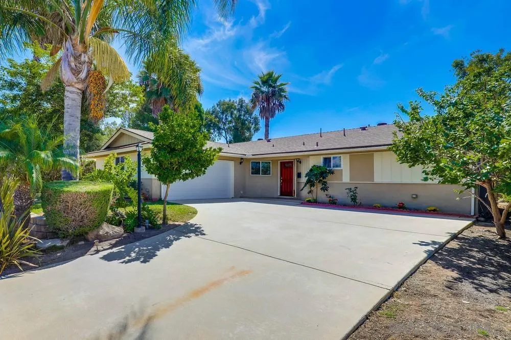 12711 Rios Road San Diego, CA 92128 - Photo 3 of 33 a front view of a house with garden