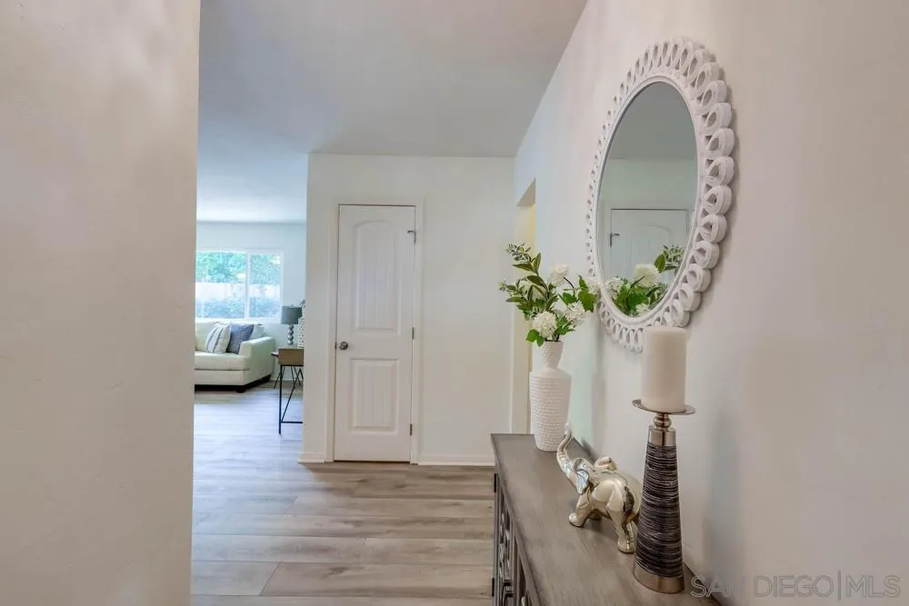 12711 Rios Road San Diego, CA 92128 - Photo 6 of 33 a view of entryway with livingroom and natural light
