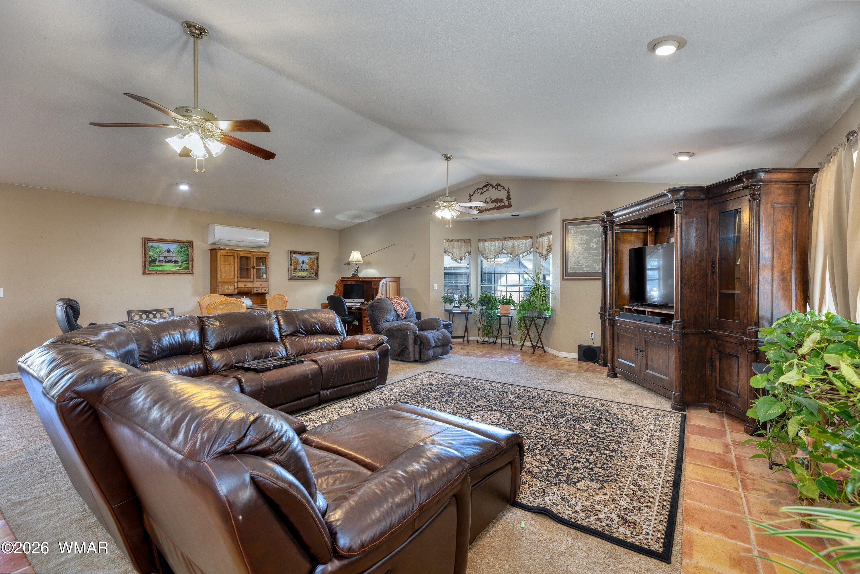1114 Ranch Road Taylor, AZ 85939 - Photo 9 of 32 a living room with furniture and a chandelier