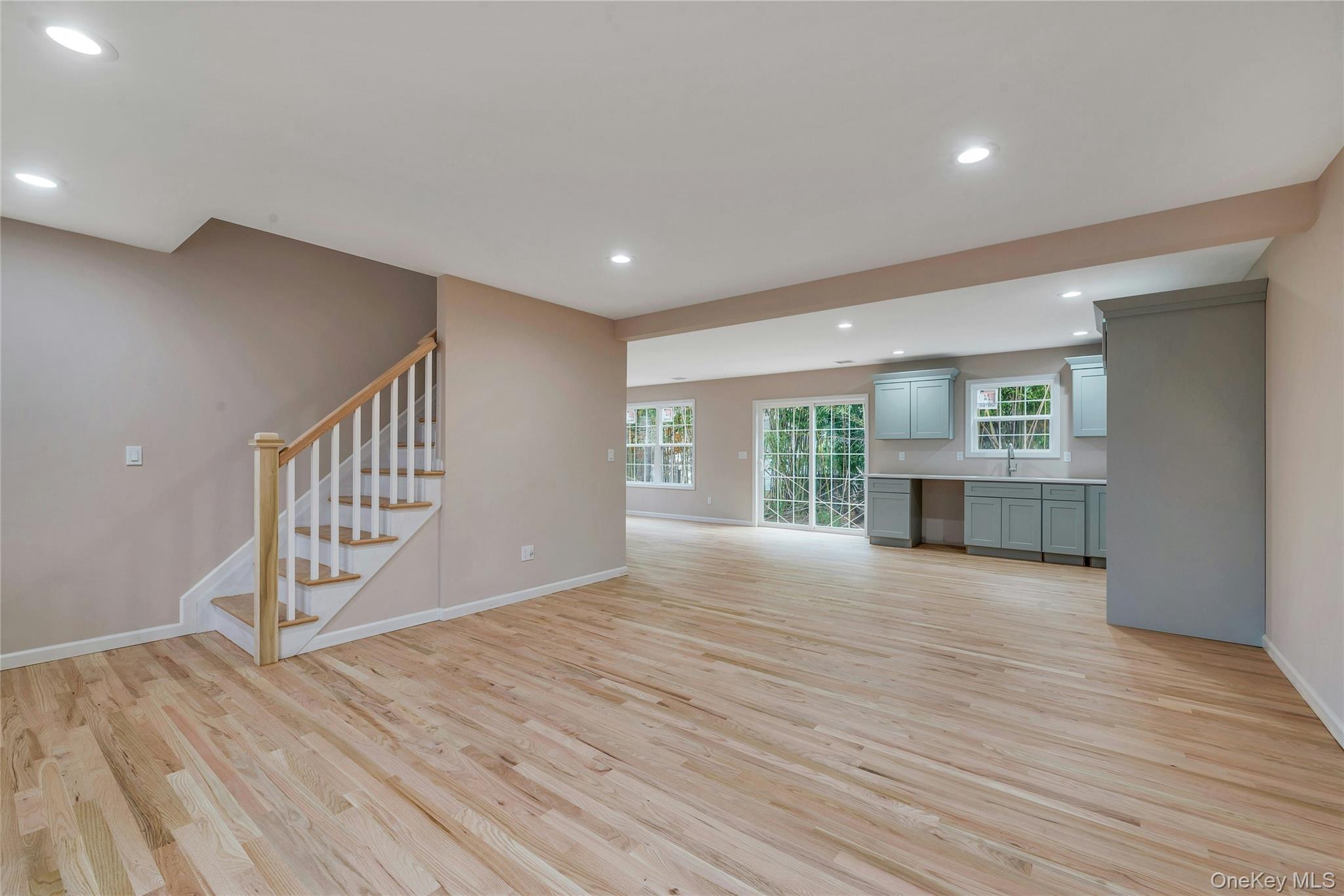 487 Neighborhood Road Shirley, NY 11967 - Photo 4 of 18 Unfurnished living room featuring recessed lighting, stairs, and light wood finished floors