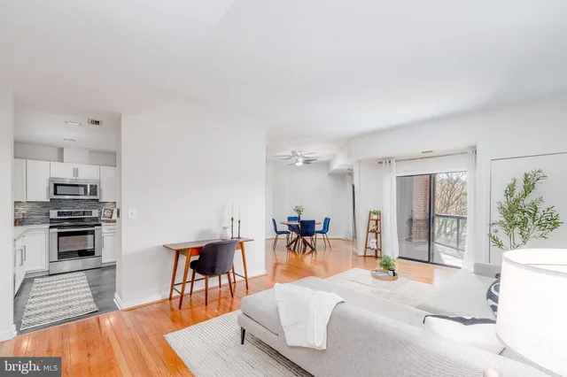 a large room with a large window and furniture