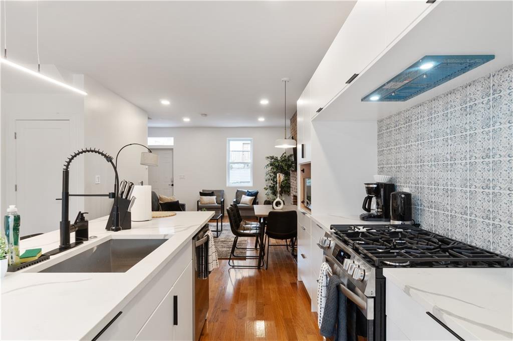 1240 Butterfield Way Pittsburgh, PA 15212 - Photo 11 of 35 a kitchen with a sink and a stove top oven