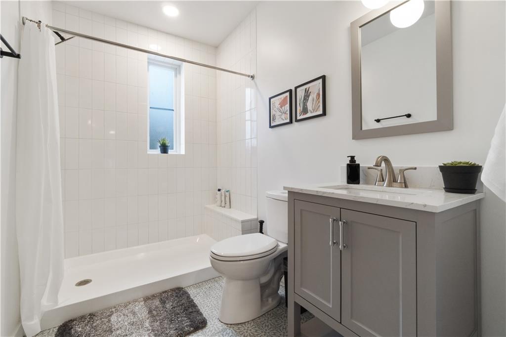 1240 Butterfield Way Pittsburgh, PA 15212 - Photo 27 of 35 a bathroom with a sink toilet and shower