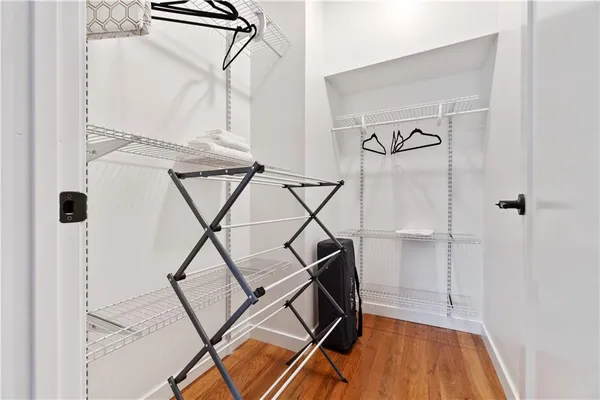 a spacious bedroom with two beds and a desk