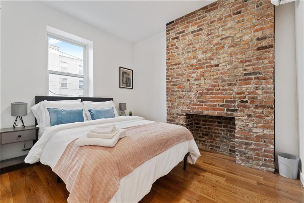 1240 Butterfield Way Pittsburgh, PA 15212 - Photo 29 of 35 a bed room with a bed and a chair