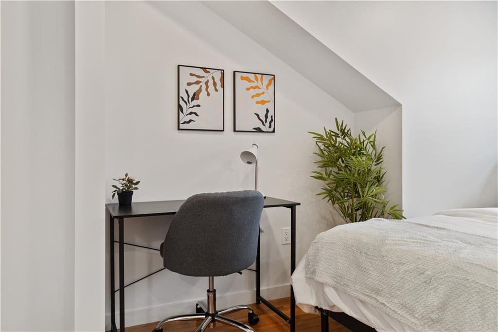 1240 Butterfield Way Pittsburgh, PA 15212 - Photo 32 of 35 a bedroom with a bed and a potted plant