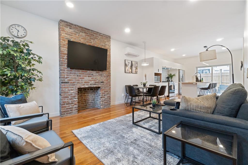 1240 Butterfield Way Pittsburgh, PA 15212 - Photo 4 of 35 a living room with furniture and a fireplace