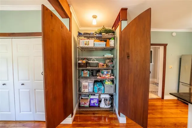 a living room with fireplace furniture and a large window