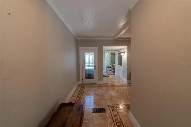 a bedroom with a bed dresser and a flat screen tv