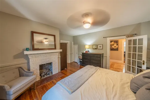 a bedroom with a bed and a dresser in it