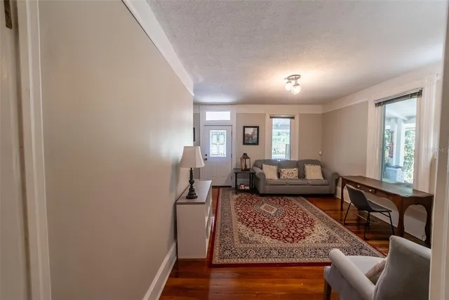 a bed room with furniture and a baby crib