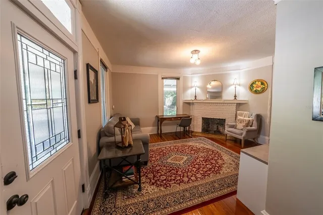 a bed room with a bed mirror and a window