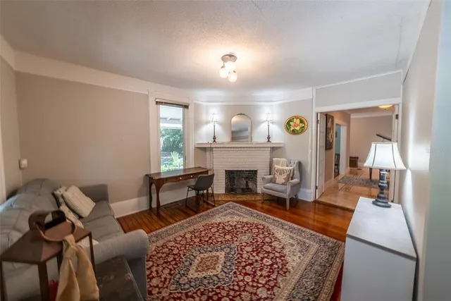 a bedroom with bed and a chandelier