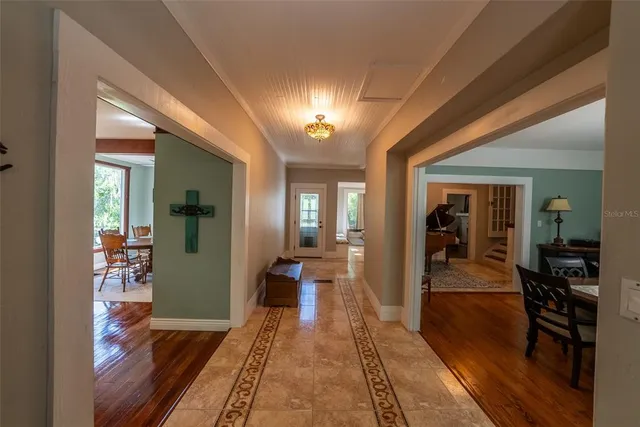 a kitchen with stainless steel appliances granite countertop a refrigerator a sink and a stove top oven