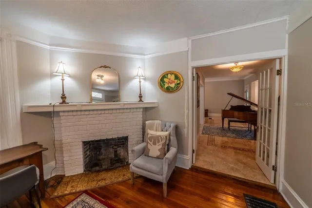 a bedroom with a bed and a mirror