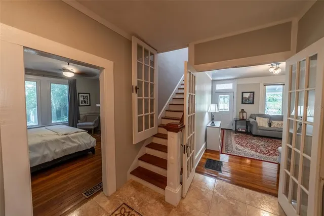 a view of a porch with chairs and backyard