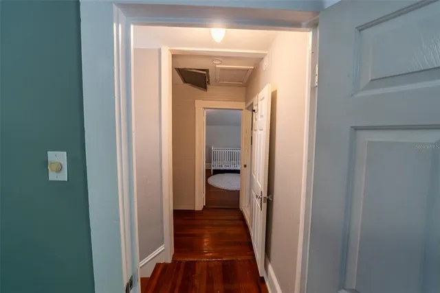 a view of backyard of house with outdoor seating and green space