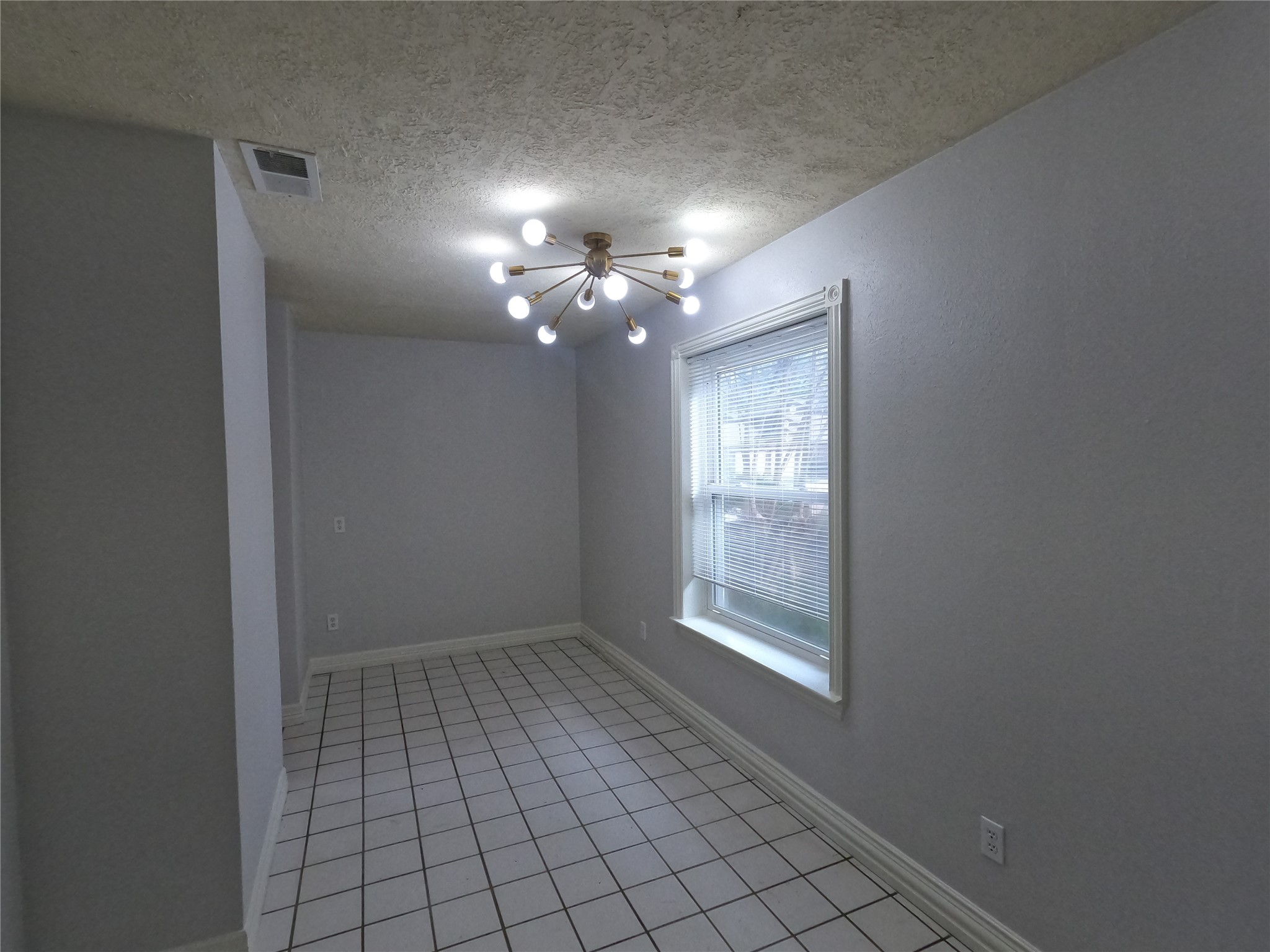 75 Willowwood Circle Spring, TX 77381 - Photo 4 of 14 a view of an empty room with a window