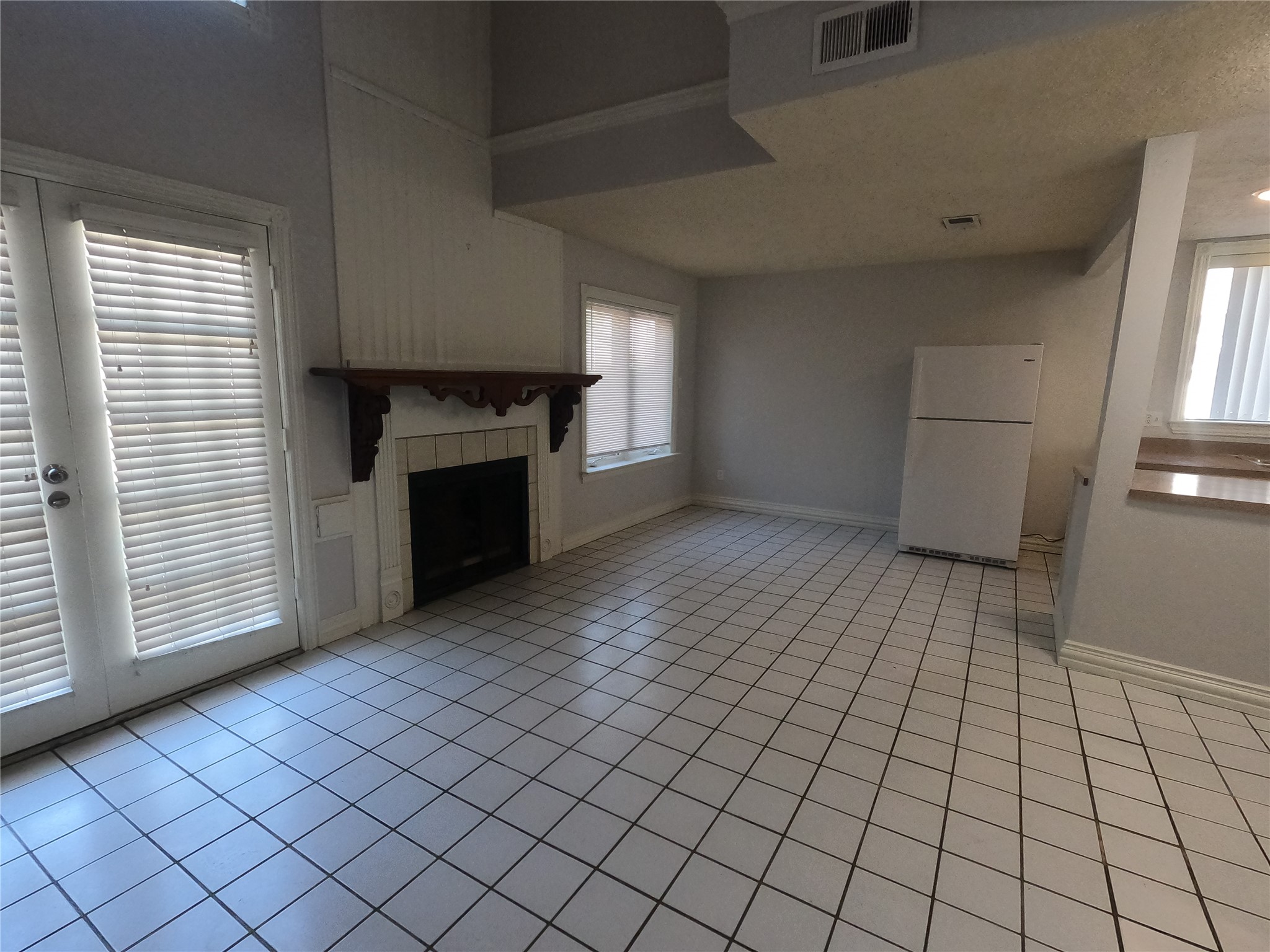 75 Willowwood Circle Spring, TX 77381 - Photo 5 of 14 a view of empty room with wooden floor and fireplace