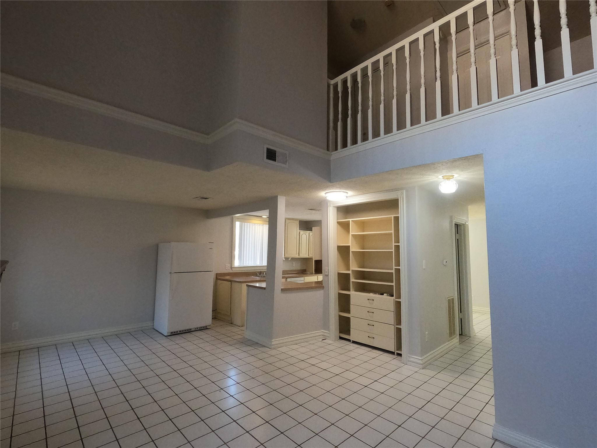 75 Willowwood Circle Spring, TX 77381 - Photo 7 of 14 a view of a kitchen with a sink dishwasher and a refrigerator