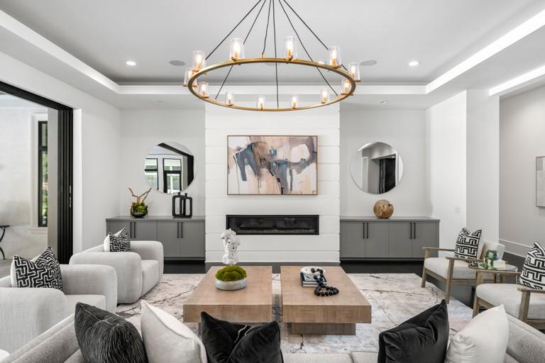 5211 Powers Ferry Road Northwest Sandy Springs, GA 30327 - Photo 10 of 106 a living room with furniture and a chandelier