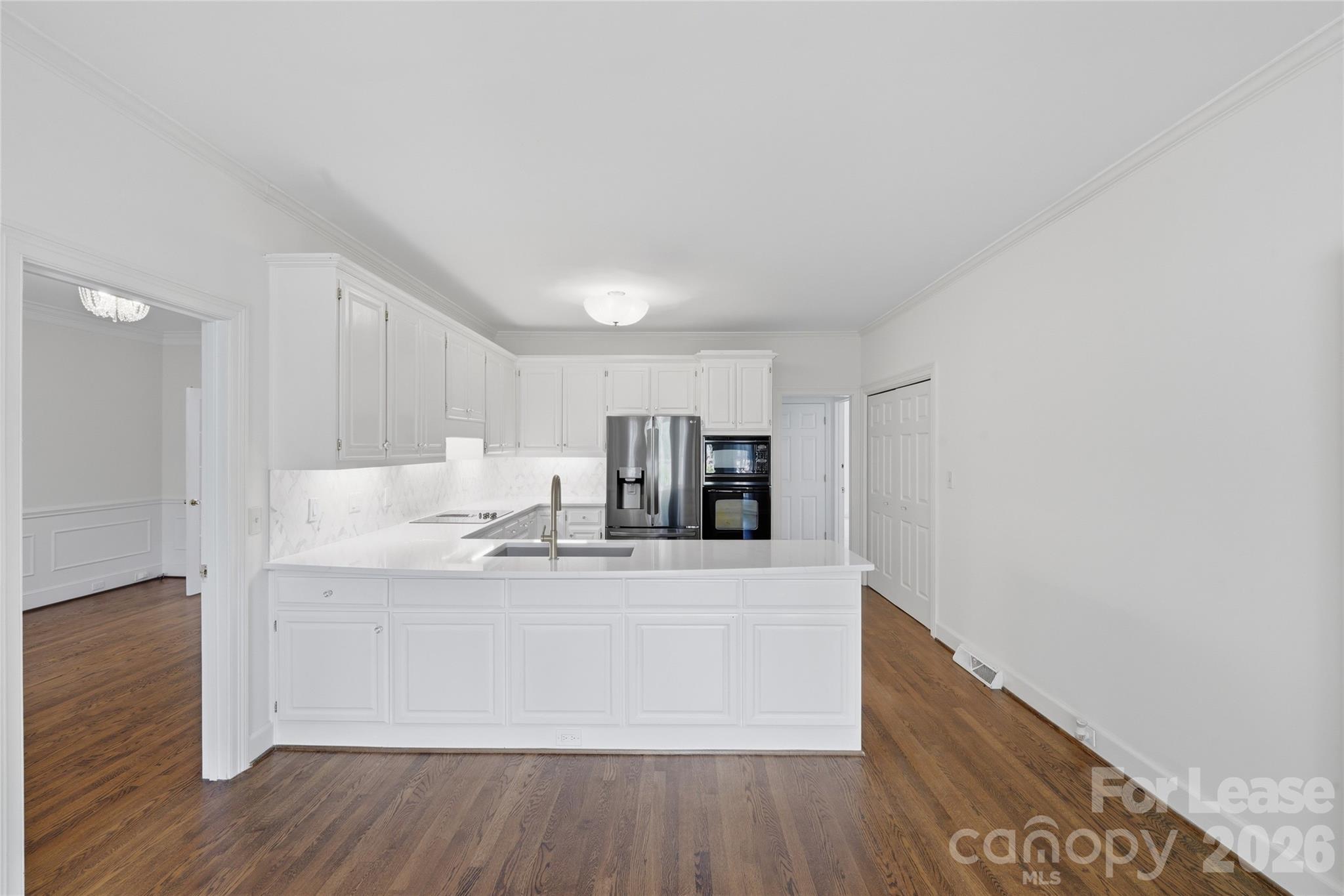5906 Sharon Hills Road Charlotte, NC 28210 - Photo 14 of 30 a view of a kitchen with wooden floor
