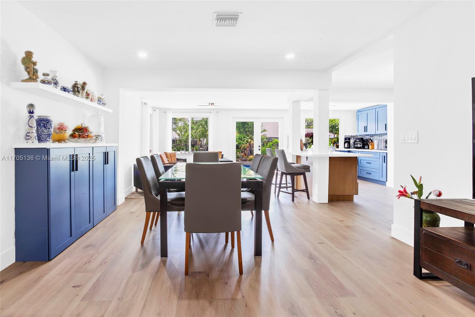 808 Mission Hill Road Boynton Beach, FL 33435 - Photo 2 of 68 a view of a dining room with furniture and wooden floor
